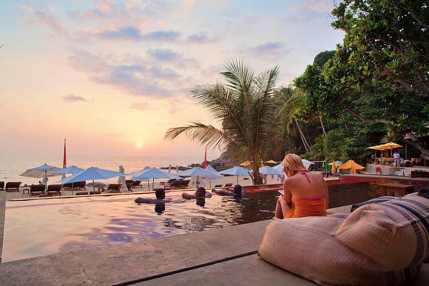 Enjoy a romantic sun set from your chair of pool at Zazada Beach Club Phuket