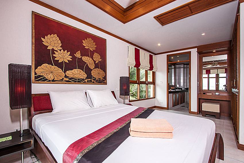 The large bedroom is decorated with beautiful pictures of Ban Talay Khaw T14
