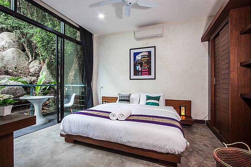 Bedrooms furnished with balcony and wardrobe of Paritta sky Villa B (Second)
