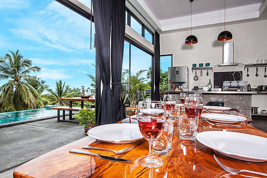 Dinning table overlooking the pool of Paritta Sky Villa A