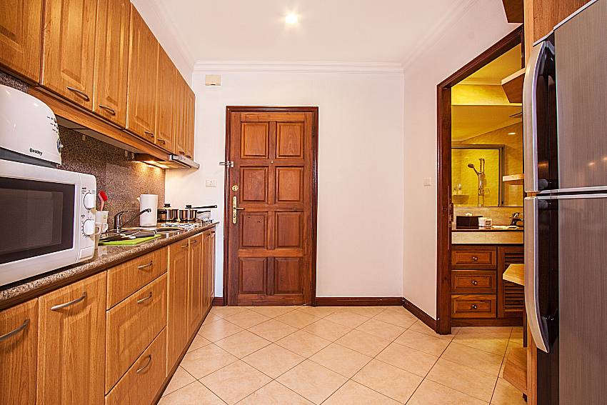 The kitchen is equipped with a bathroom of Sirinda Residence No.74