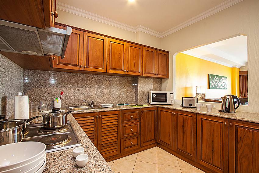 Kitchen room with cooking corner and shelves of Sirinda Residence No.25