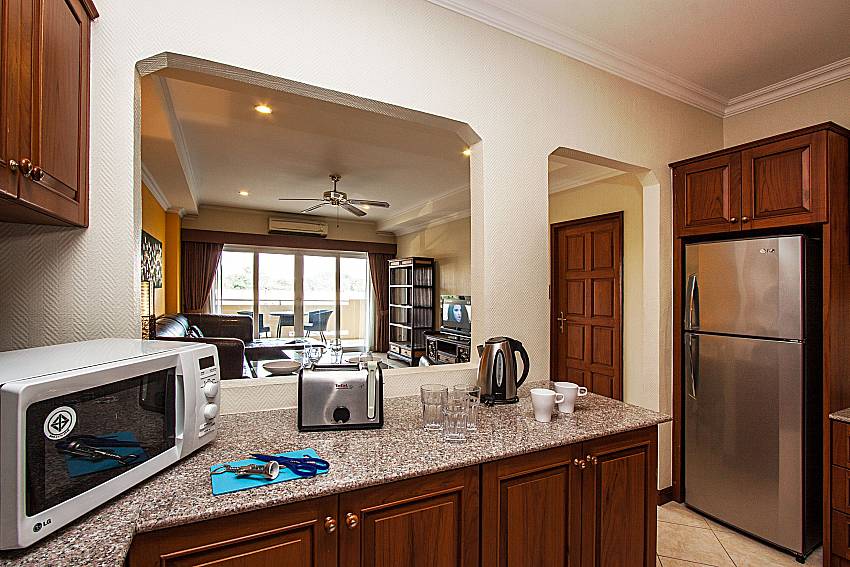 Kitchen with a microwave and refrigerator in of Sirinda Residence No.25