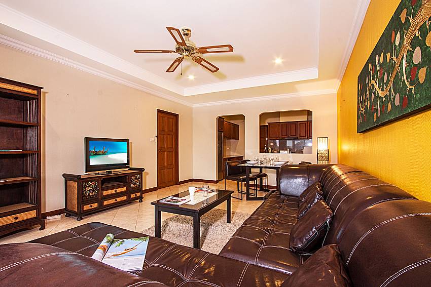 Living room with shelves and TV of Sirinda Residence No.25