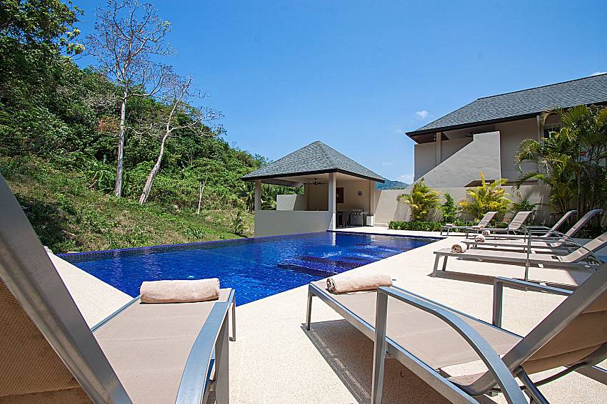 Sun bed near swimming pool Si Mok Villa in Phuket 