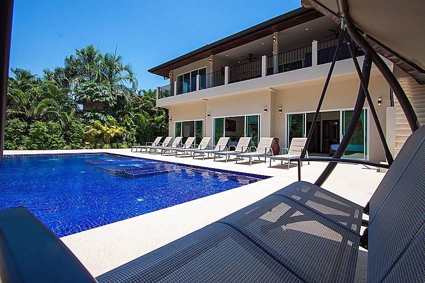 Sun bed near swimming pool Si Fah Villa in Phuket 