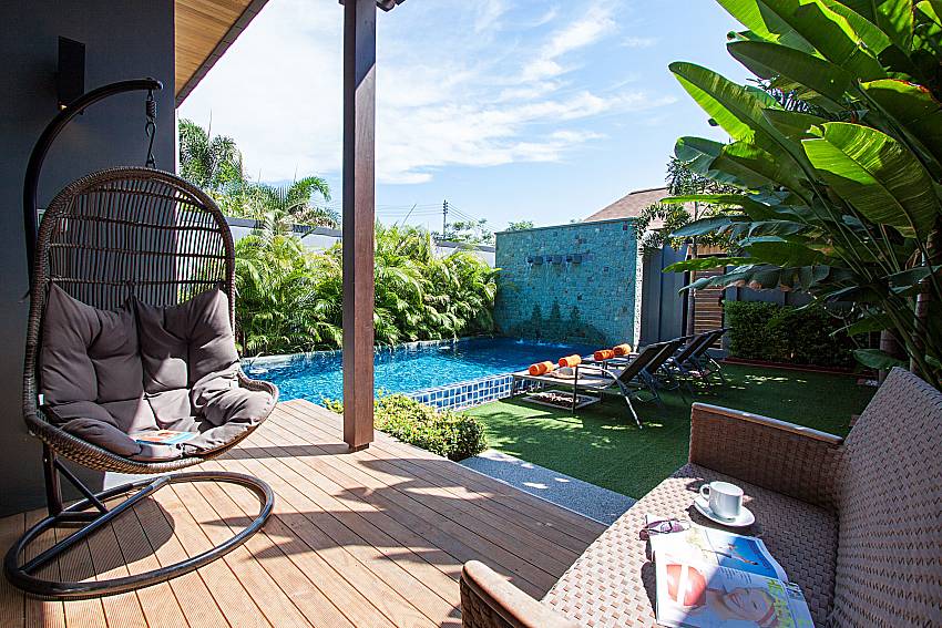 Seat near swimming pool Preuk Sah Villa in Phuket