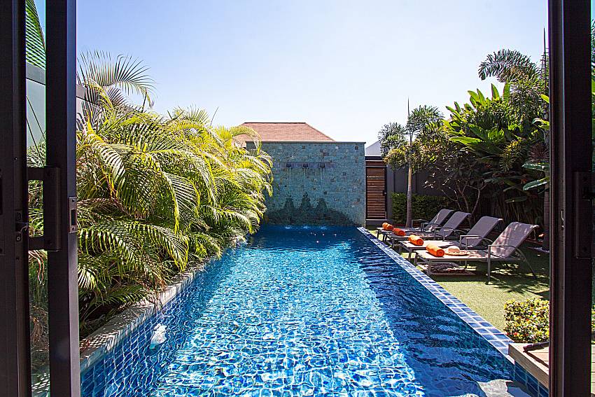 Sun bed near swimming pool Preuk Sah Villa in Phuket 