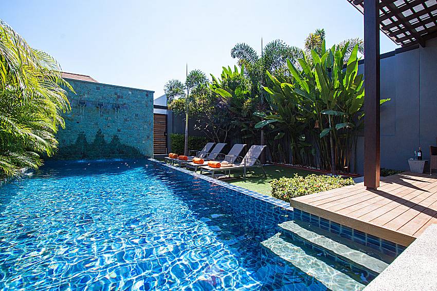 Sun bed near swimming pool Preuk Sah Villa in Phuket