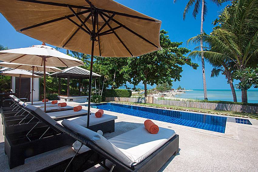 Sun bed near swimming pool with sea view Blossom Dew Villa A in Samui