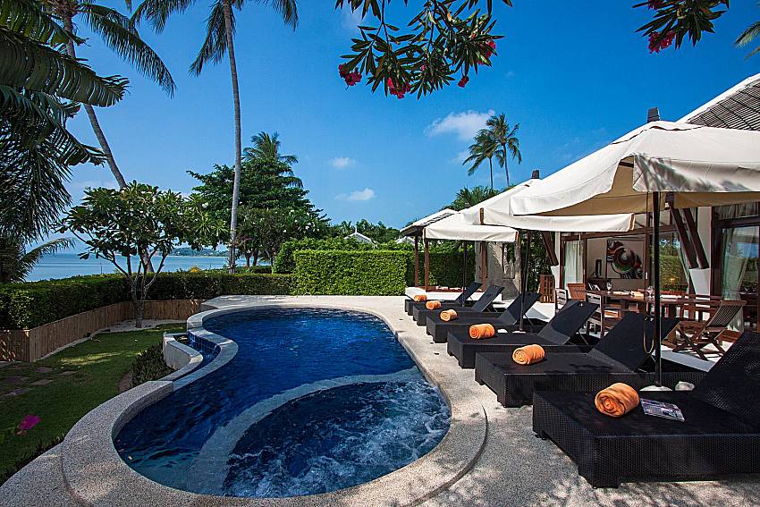 Sun bed near swimming pool with sea view Blossom Dew Villa D in Koh Samui
