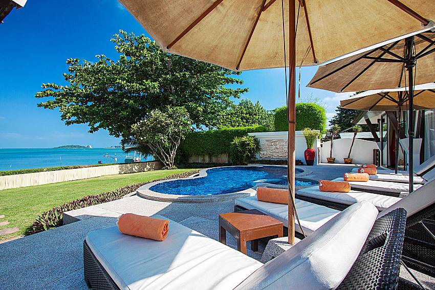 Sun bed near swimming pool with sea view Blossom Dew Villa E in Samui 