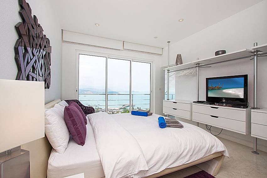 Bedroom with TV Sirinda Samui Sea View Apartment in Samui 