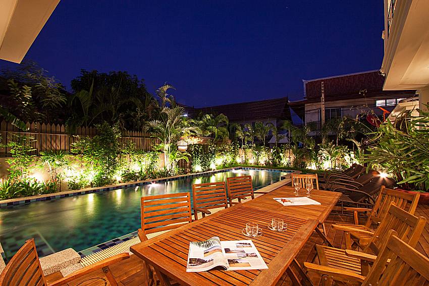 Seat and table near swimming pool City Haven Villa in Central Pattaya