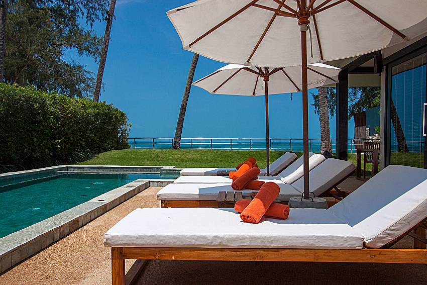 Sun bed near swimming pool with sea view Nikki Beach Resort - Beach Front Star 2 in Samui