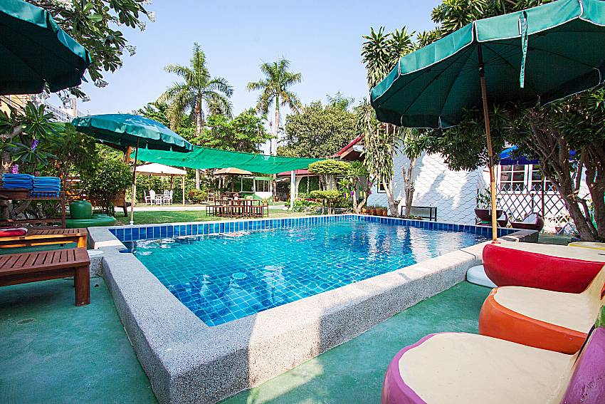 Sun bed near swimming pool Villa Nobility Jomtien Beach in Pattaya