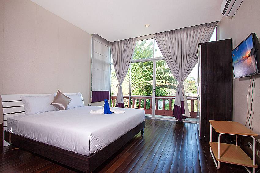 Bedroom with TV Baan Mork Nakara B in East Pattaya