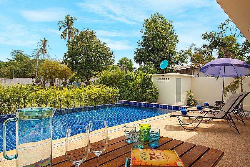 Sun bed near swimming pool Villa Tallandia in Rawai Phuket