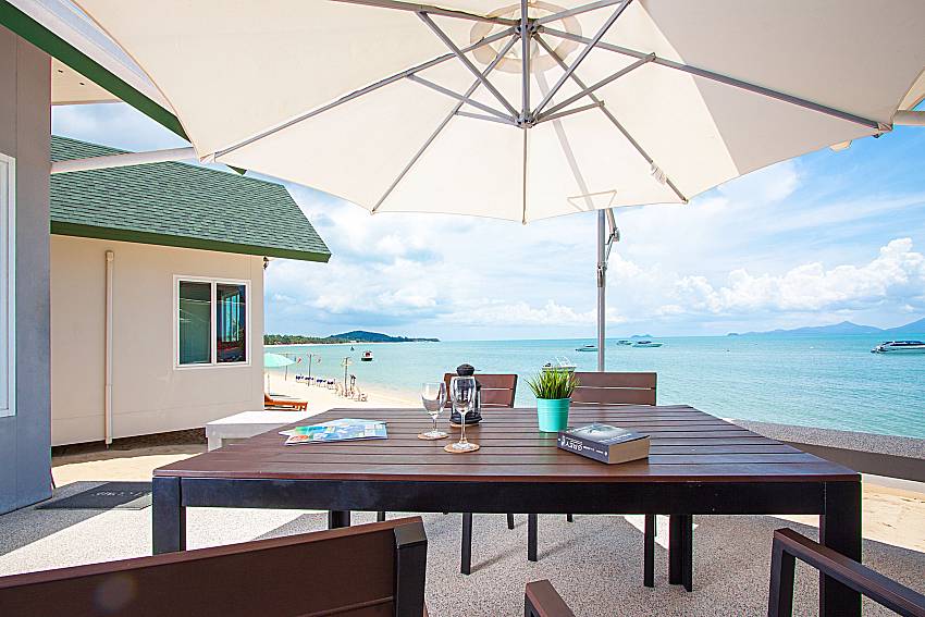 Seat and table with sea view Interstellar Beachfront Villa B in Samui