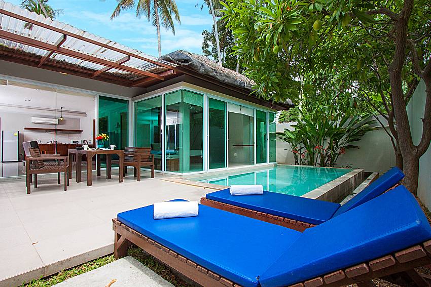 Sun bed near swimming pool and property Moonscape Villa 207 at Chaweng in Samui