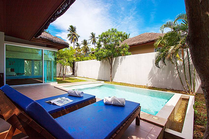 Sun bed near swimming pool and property Moonscape Villa 102 at Chaweng in Samui