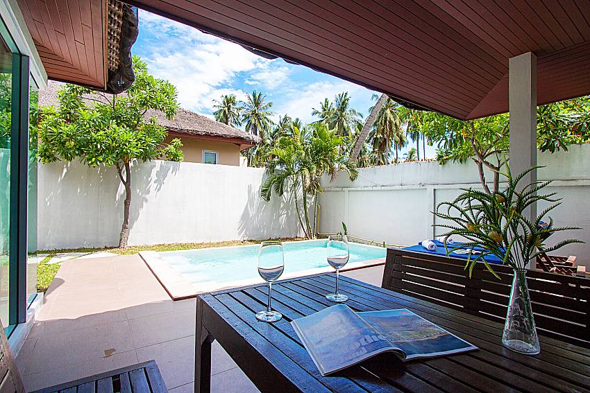 Seat and table near swimming pool Moonscape Villa 102 at Chaweng in Samui