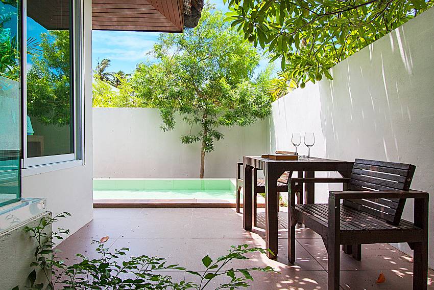 Seat and table near swimming pool Moonscape Villa 206 in Koh Samui 