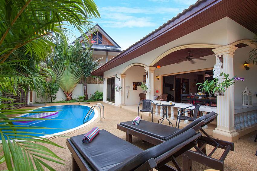 Sun bed near swimming pool and property Genna in Rawai Phuket