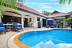 Sun bed near swimming pool and property Villa Onella in Phuket