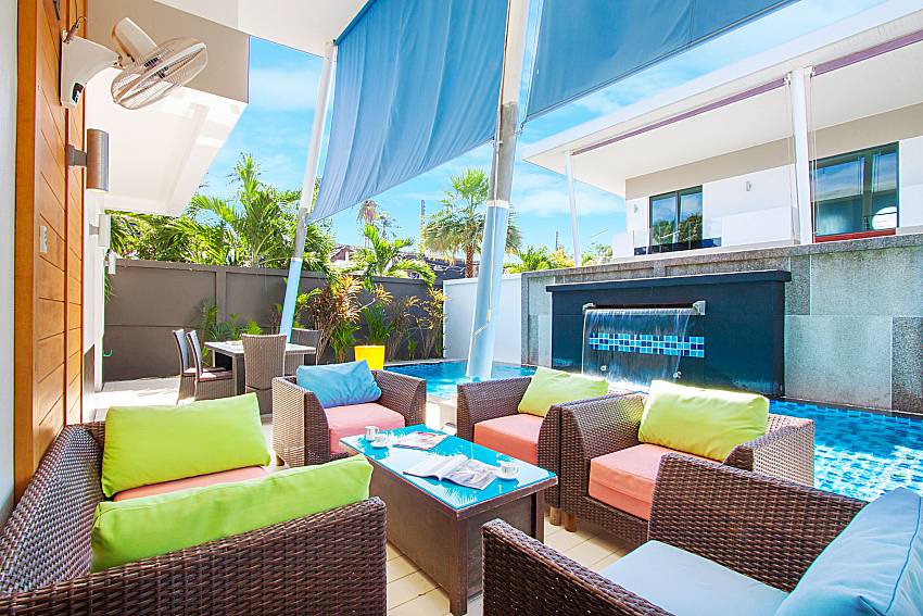 Sofa and table near swimming pool Villa Fullan in Phuket
