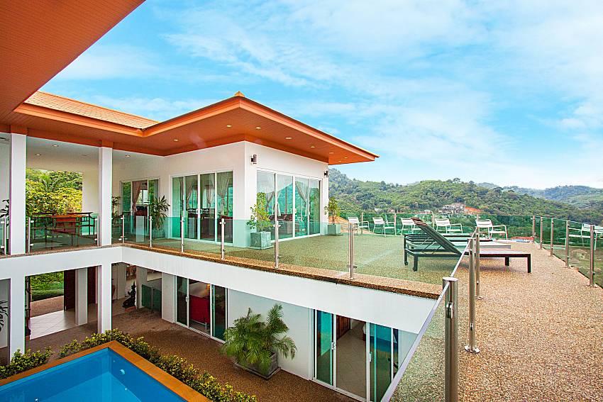 Balcony with sun bed and property Villa Niyati in Phuket