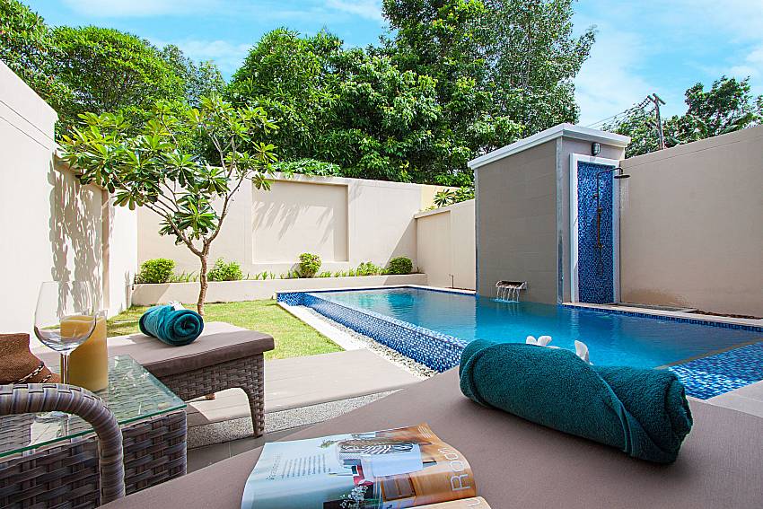 Sun bed near swimming pool Poonam Villa in Phuket