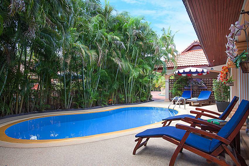 Sun bed near swimming pool Villa Maiki at Rawai in Phuket 