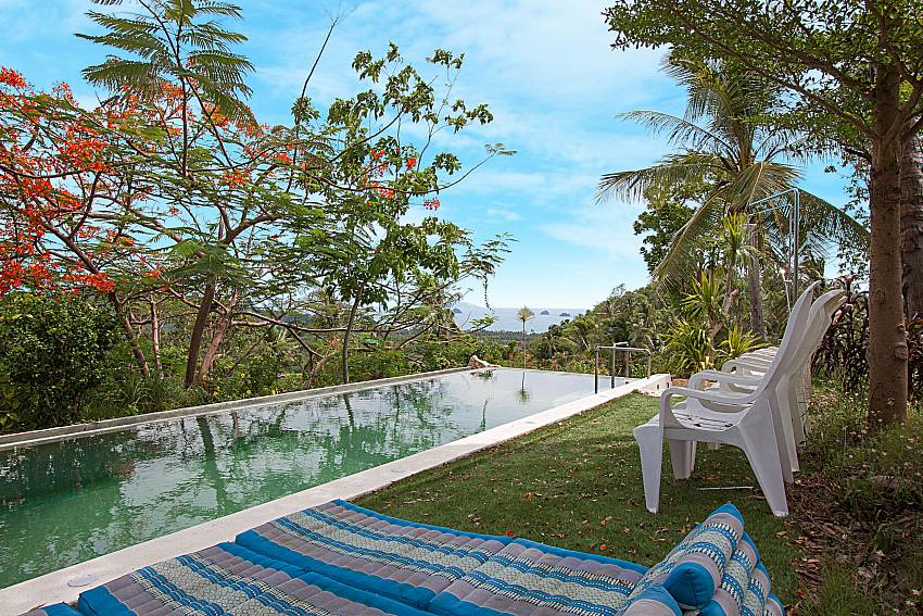 Sun bed near swimming pool with sea view Hin Villa in Koh Samui 