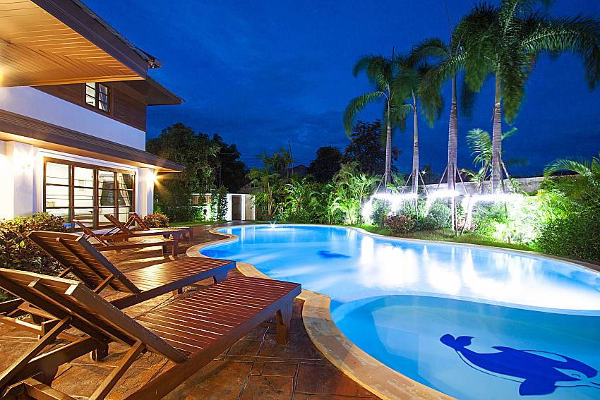 Sun bed near swimming pool Lanna Karuehaad Villa B in Chiang Mai