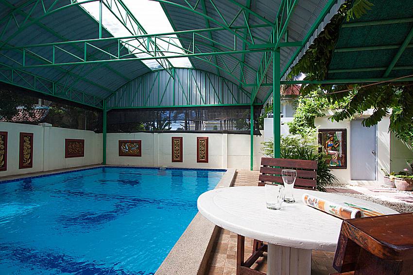 Seat and table near swimming pool Baan Janpen in Pattaya