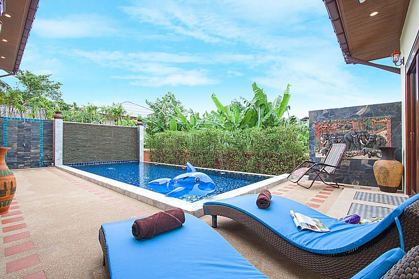 Sun bed near swimming pool Swy Residence in Koh Samui