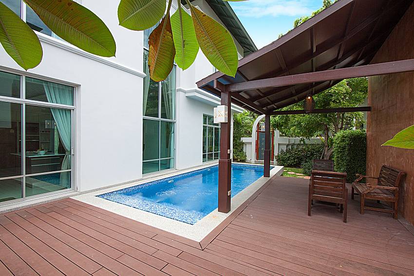 Seat and table near swimming pool Villa Modernity A in Pattaya