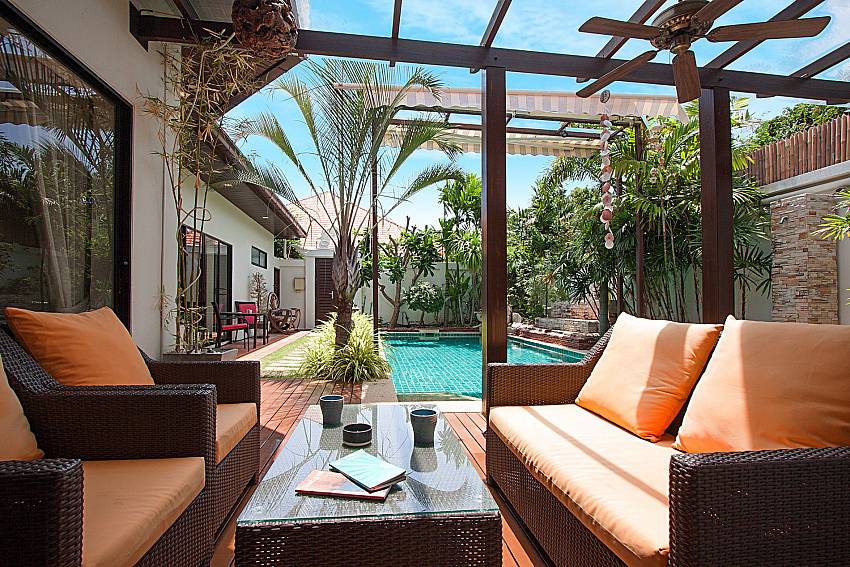 Sofa and table near swimming pool Villa Majestic 67 in Pratumnak Pattaya