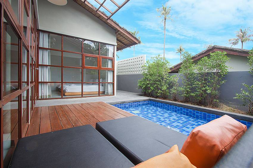 Sun bed near swimming pool with property Villa Rune 202 in Koh Samui