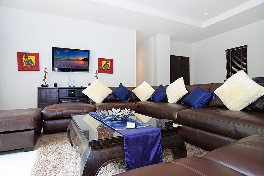 Comfortable couch and TV at Villa Anyamanee in South Phuket