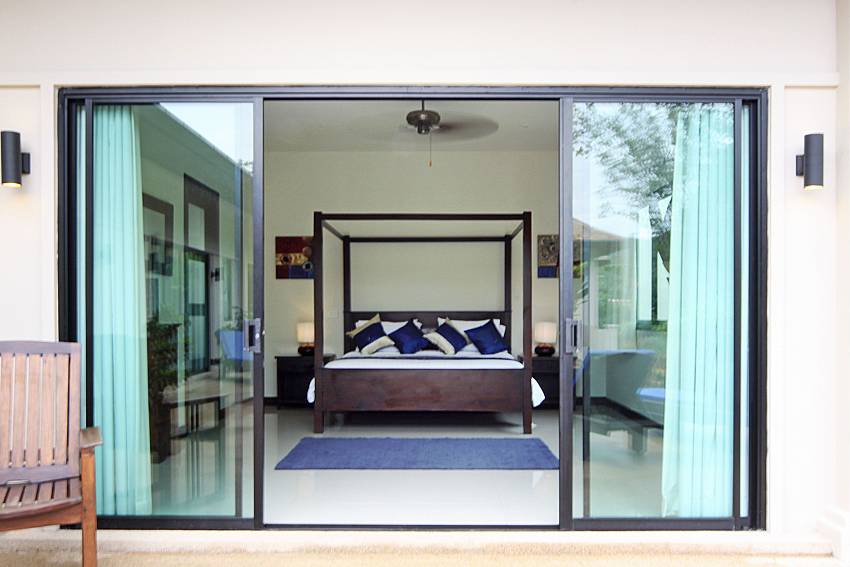 Master bedroom with direct pool access at Villa Anyamanee Phuket