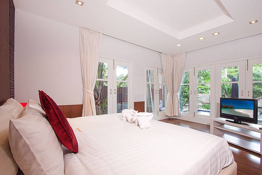 Bedroom with TV and garden view at Villa Hutton 103 Koh Samui Bophut