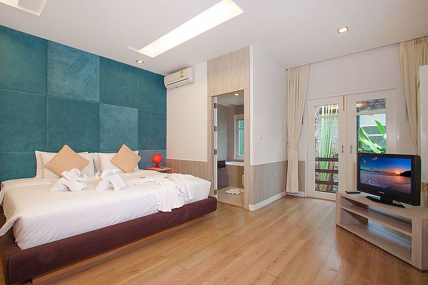 Master bedroom with TV and king size bed atVilla Hutton 201 Samui Bophut