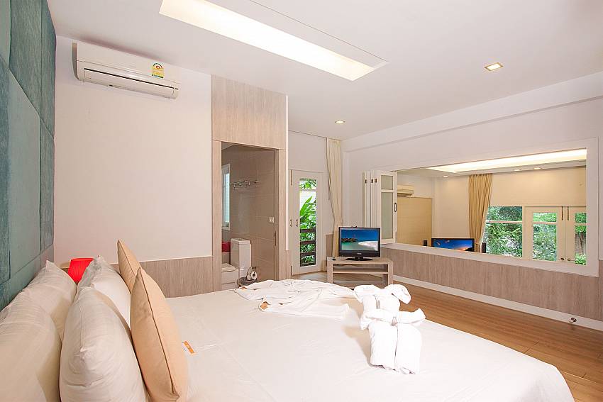 Master bedroom with king size bed and TV at Villa Hutton 201 Koh Samui Bophut
