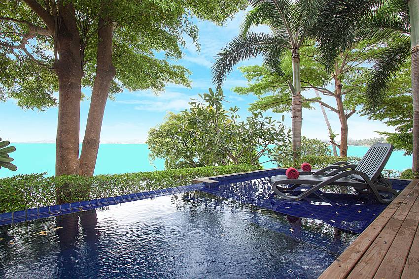 Sun bed near swimming pool with sea view Villa Hutton 210 in Koh Samui