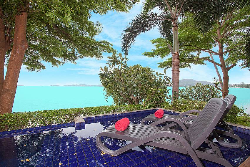 Sun bed near swimming pool with sea view Villa Hutton 210 in Koh Samui