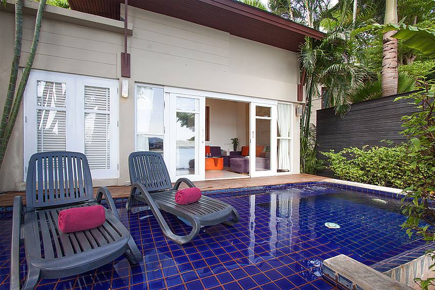 Sun bed near swimming pool with property Villa Hutton 211 in Samui