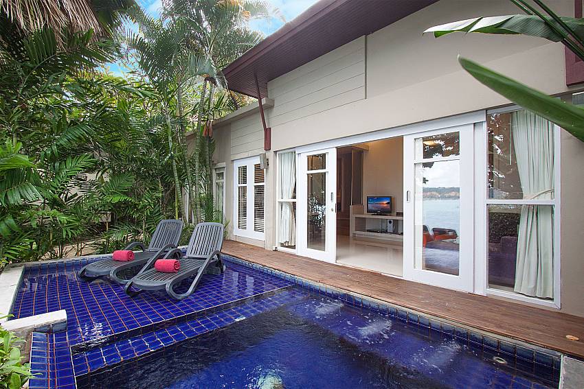 Sun bed near swimming pool with property Villa Hutton 212 in Koh Samui