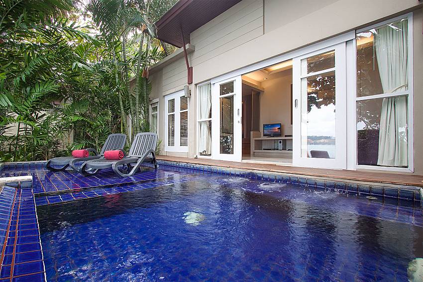 Sun bed near swimming pool with property Villa Hutton 212 in Koh Samui
